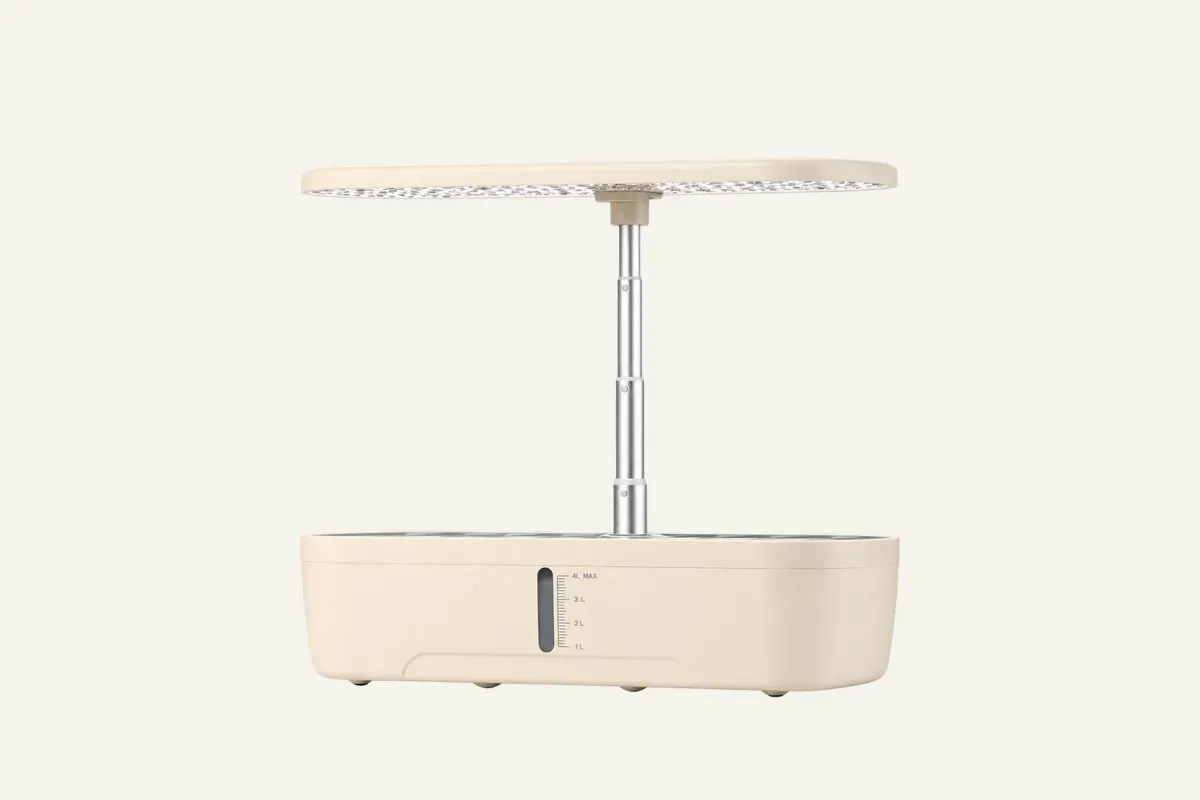 Front view of GrowGrid 12-Pod showing its cream reservoir, single-post lamp and water-level window; existing supplier image